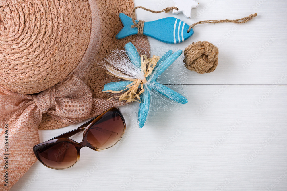 Sunglasses, hat and summer accessories on white wood background Sunglasses, hat and summer accessories on white wood background