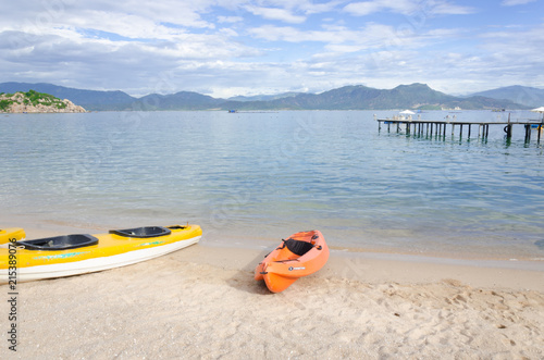 kayak and small boat on the beach