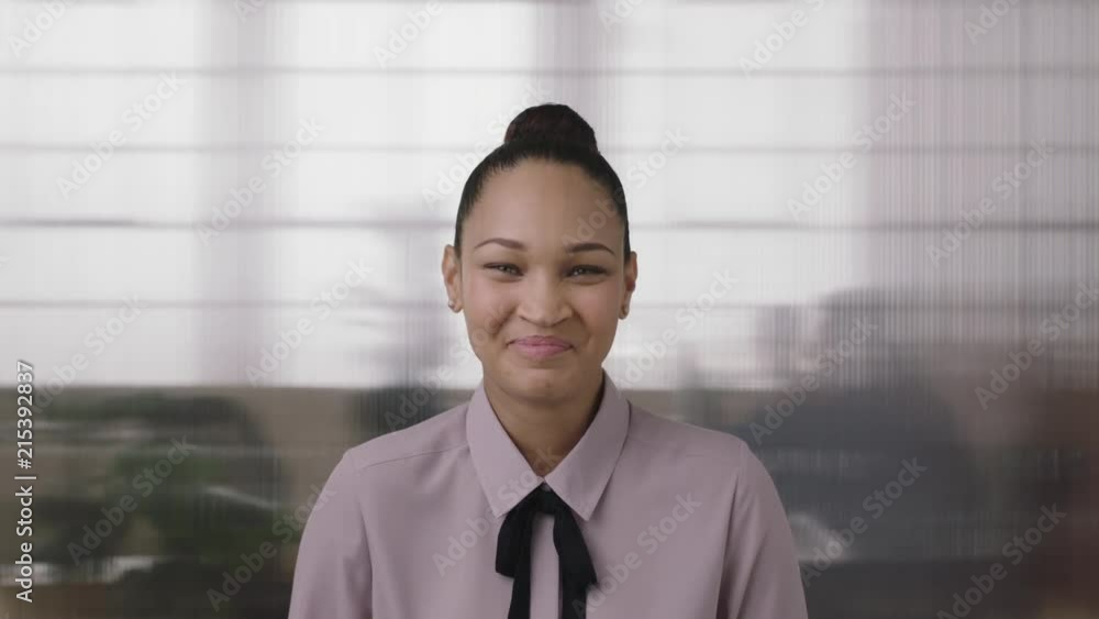 close up portrait of beautiful young mixed race business woman intern laughing cheerful enjoying fun in office workspace background close up portrait of beautiful young mixed race business woman intern laughing cheerful enjoying fun in office workspace background
