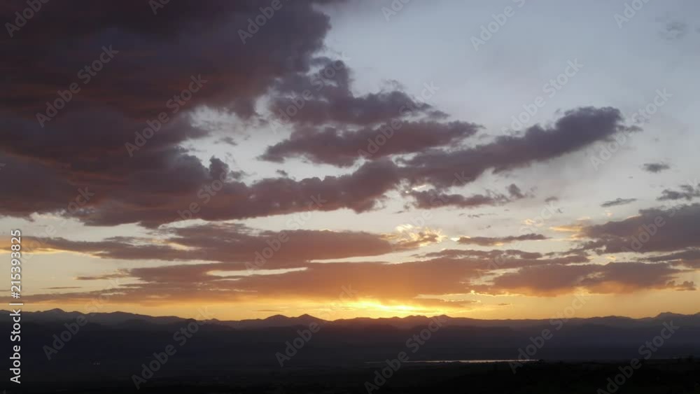 A beautiful time-lapse capturing a Colorado sunset over the Rocky Mountains A beautiful time-lapse capturing a Colorado sunset over the Rocky Mountains