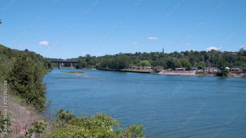 Beautiful Blue River with Walking Bridge in Background Beautiful Blue River with Walking Bridge in Background