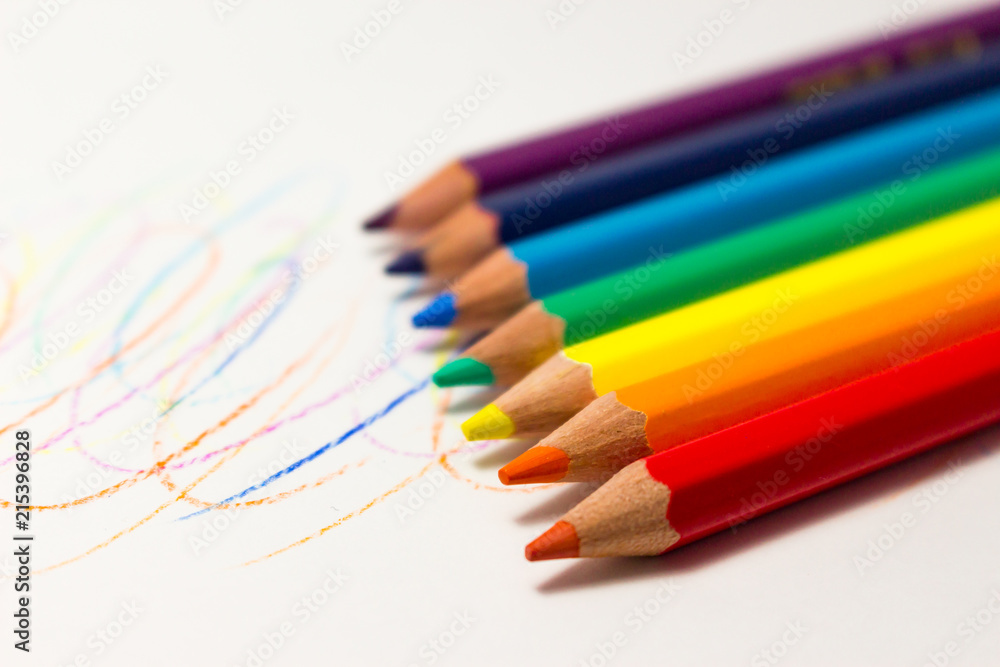 Fototapeta premium Color pencils on white background, rainbow colors