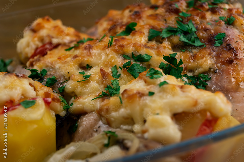 Chicken meat, baked with vegetables and cheese under a ruddy crust, sprinkled with chopped parsley. Chicken meat, baked with vegetables and cheese under a ruddy crust, sprinkled with chopped parsley.
