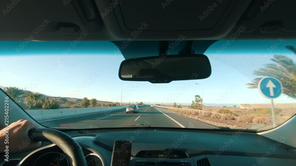 Driving at sunset on a motorway Driving at sunset on a motorway