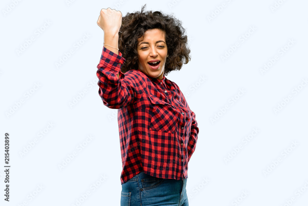 Beautiful arab woman happy and excited expressing winning gesture. Successful and celebrating victory, triumphant Beautiful arab woman happy and excited expressing winning gesture. Successful and celebrating victory, triumphant