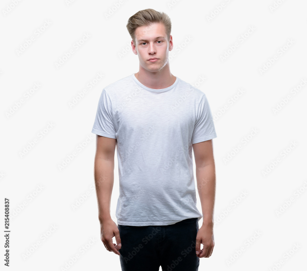 Young handsome blond man with a confident expression on smart face thinking serious Young handsome blond man with a confident expression on smart face thinking serious