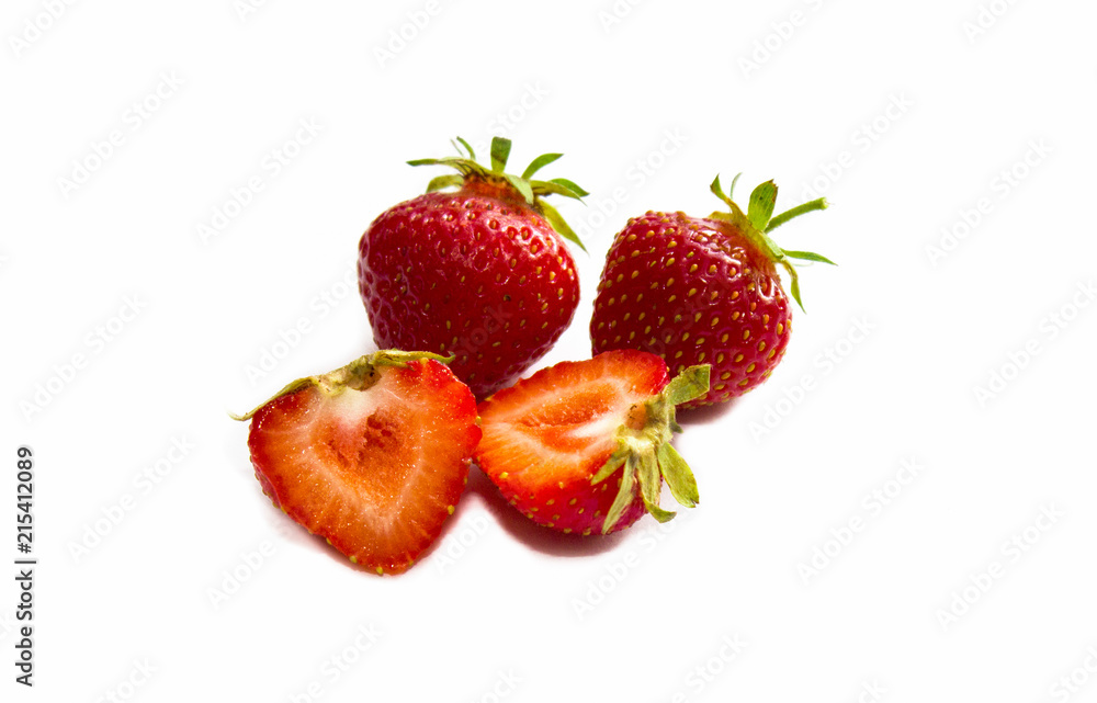Strawberry with sliced half and leaves isolated on white background with clipping path. Strawberry whole and cut into halves. Close-up. Red strawberries. Strawberry with sliced half and leaves isolated on white background with clipping path. Strawberry whole and cut into halves. Close-up. Red strawberries.
