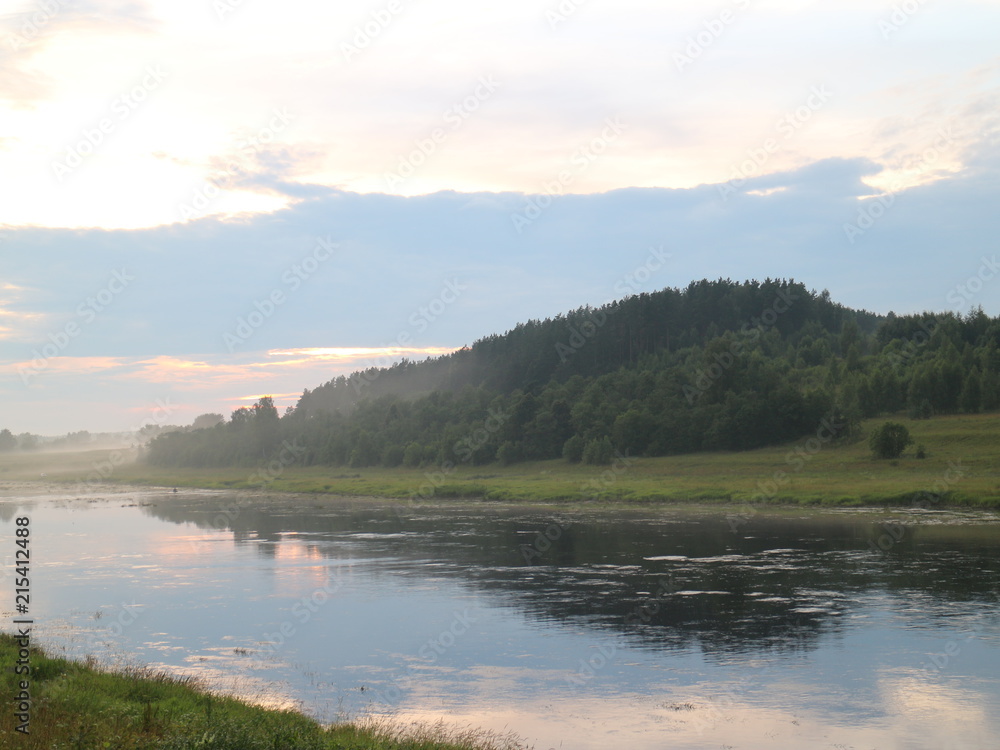 Fishing on the river in the summer evening