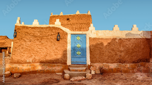 Old Arabic House with Door and Antique Lanterns - Traditional Arab Mud Architecture - Part of an Old Fort – Home Made of Sand – Saudi Old Traditional House at Morning - Riyadh - Diriyah, Saudi Arabia photo