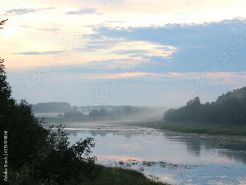 Fishing on the river in the summer evening