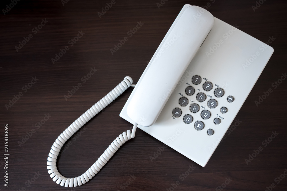 white telephone on wooden background white telephone on wooden background