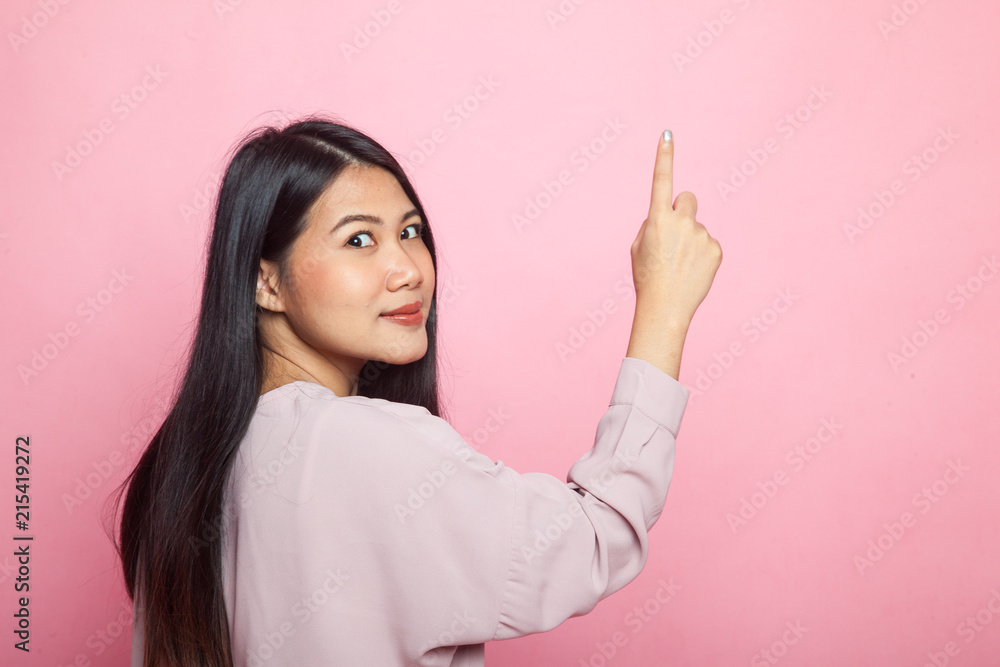 Back of Asian woman touching the screen with her finger. Back of Asian woman touching the screen with her finger.