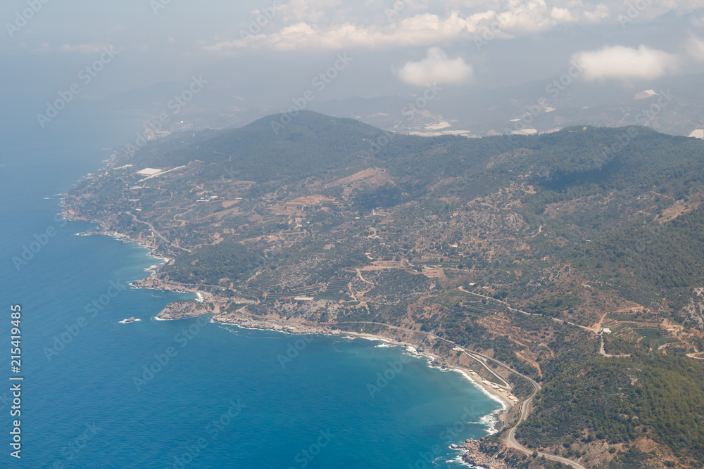 Beautiful view of the Mediterranean coast, in the Antalya region, Turkey from the height of the flying plane