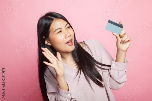 Young Asian woman happy with  blank card.