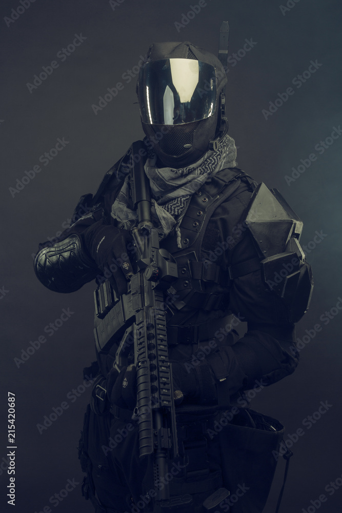 Cosplay futuristic solder. Dark background, hazy air.