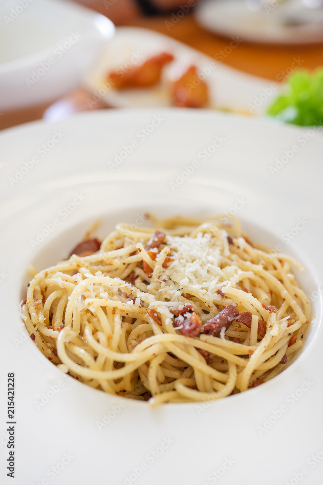 picy spaghetti bacon - spaghetti with bacon, chilli, garlic, tomato, black  olive on top Parmesan cheese and parsley.