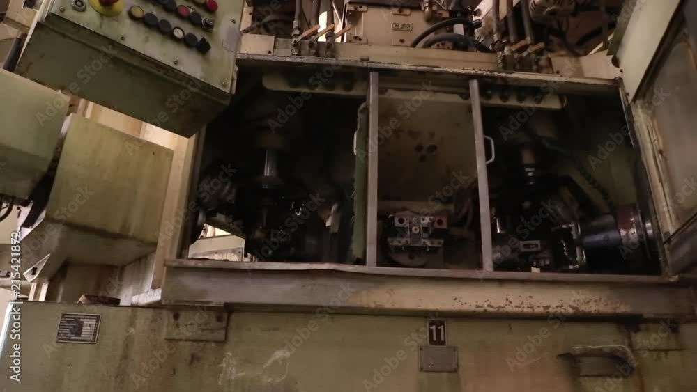 some kind of old broken machine in an abandoned factory CLOSE UP/PULL UP SHOT some kind of old broken machine in an abandoned factory CLOSE UP/PULL UP SHOT