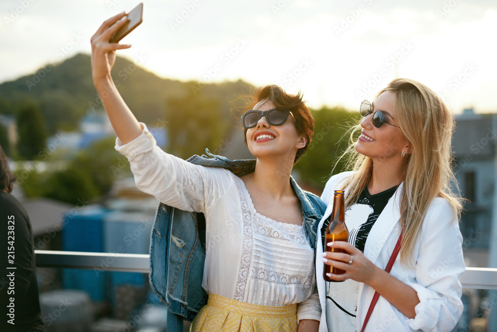 Attractive Women Making Photo On Mobile Phone Attractive Women Making Photo On Mobile Phone