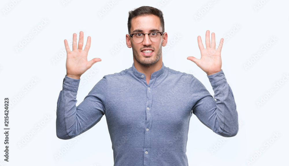 Handsome young elegant man wearing glasses showing and pointing up with fingers number ten while smiling confident and happy. Handsome young elegant man wearing glasses showing and pointing up with fingers number ten while smiling confident and happy.