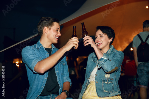 Couple Drinking Beer On Party Outdoors