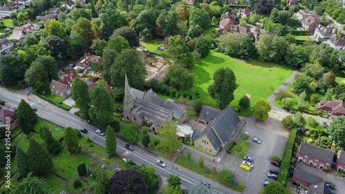 Drone passing over Radlett church UK daytime. Rural country side village, town. photo