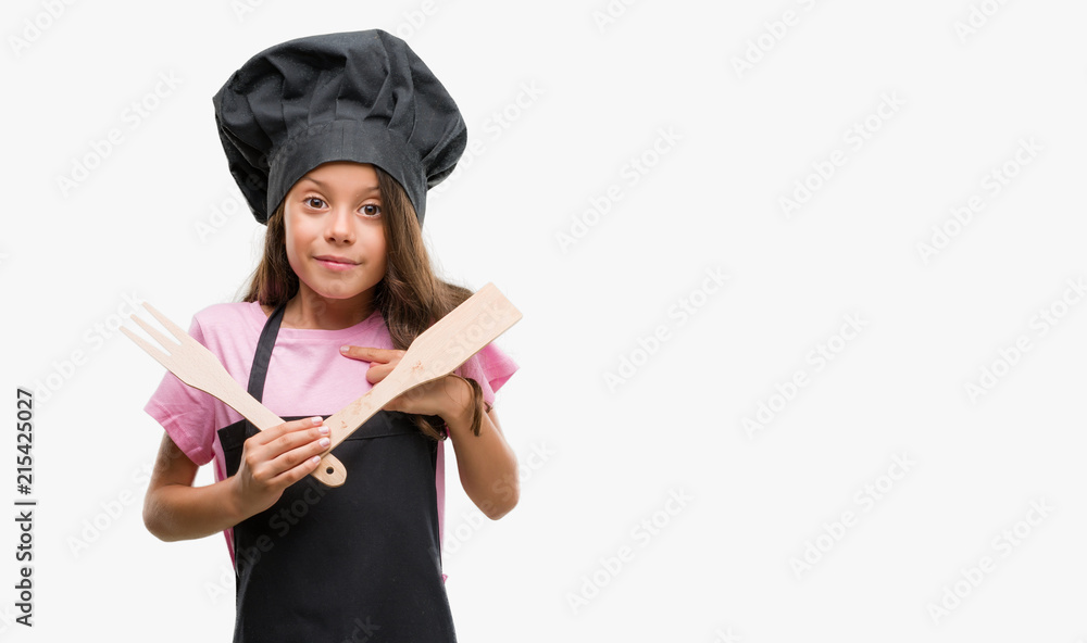 Brunette hispanic girl wearing cook uniform with surprise face pointing finger to himself Brunette hispanic girl wearing cook uniform with surprise face pointing finger to himself