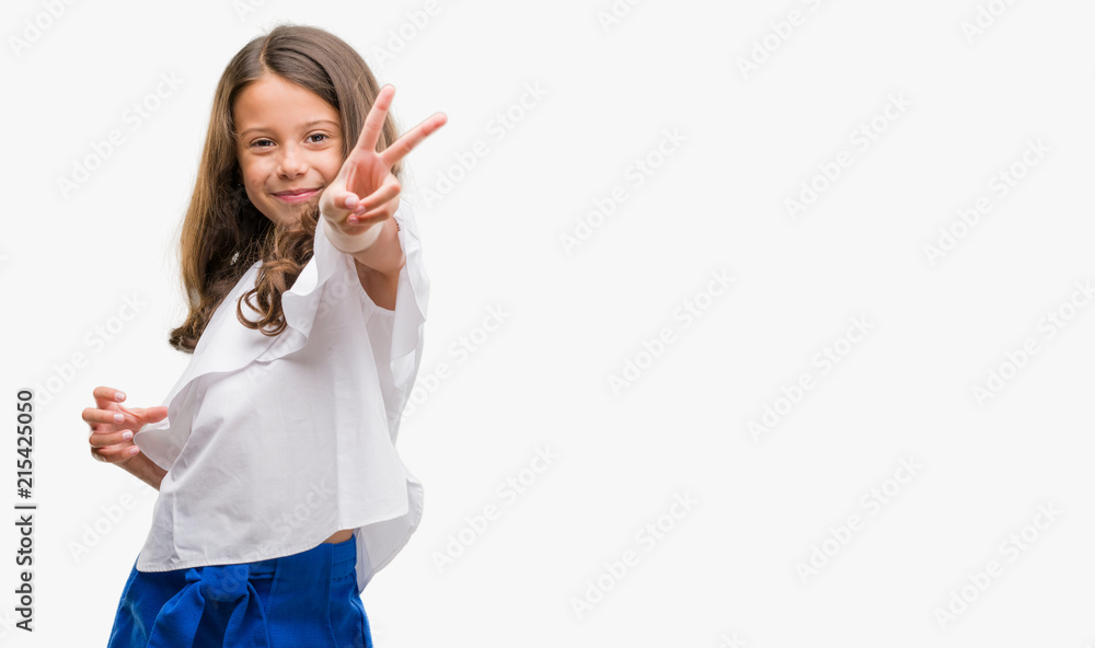 Brunette hispanic girl smiling looking to the camera showing fingers doing victory sign. Number two. Brunette hispanic girl smiling looking to the camera showing fingers doing victory sign. Number two.