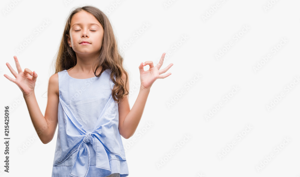 Brunette hispanic girl relax and smiling with eyes closed doing meditation gesture with fingers. Yoga concept. Brunette hispanic girl relax and smiling with eyes closed doing meditation gesture with fingers. Yoga concept.