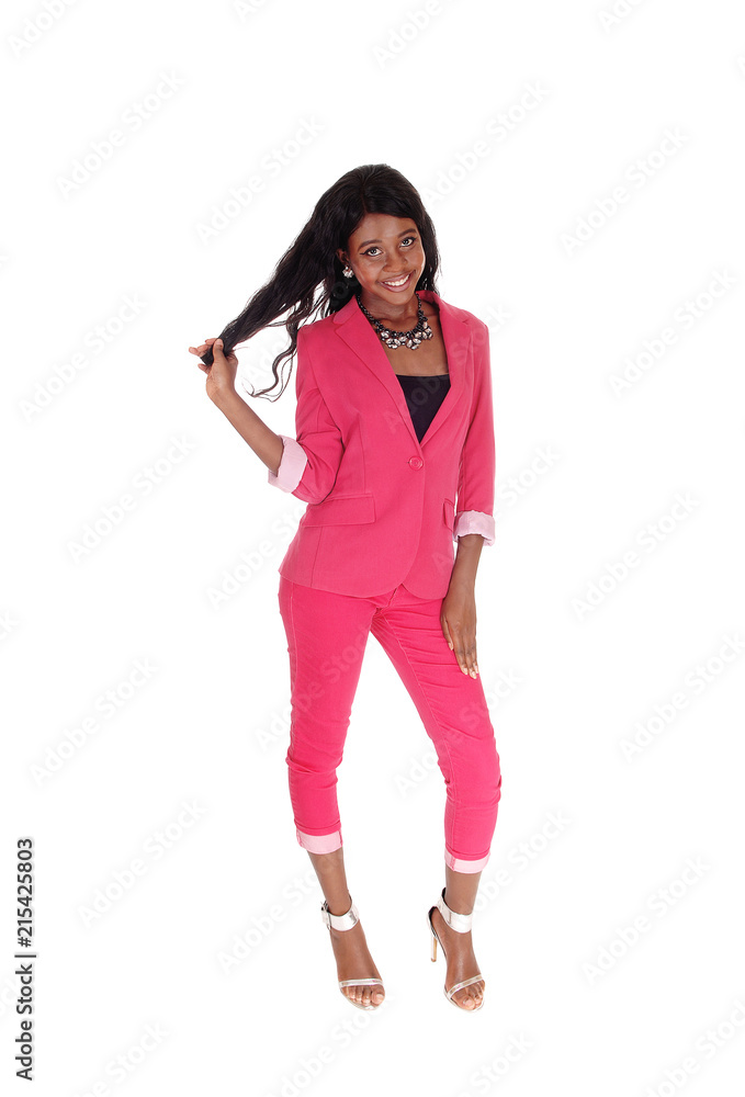 Fototapeta premium Portrait of a lovely African woman pulling her hair