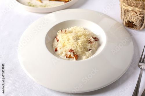 Close-up risotto with chanterelle mushrooms and grated parmesan