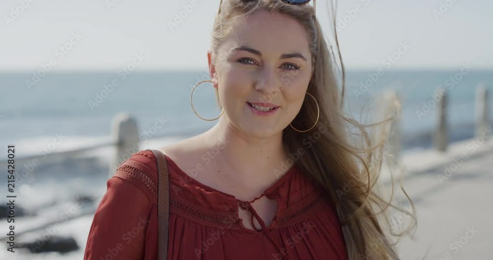 portrait beautiful young blonde woman laughing enjoying vacation successful female on sunny ocean seaside wind blowing hair slow motion portrait beautiful young blonde woman laughing enjoying vacation successful female on sunny ocean seaside wind blowing hair slow motion