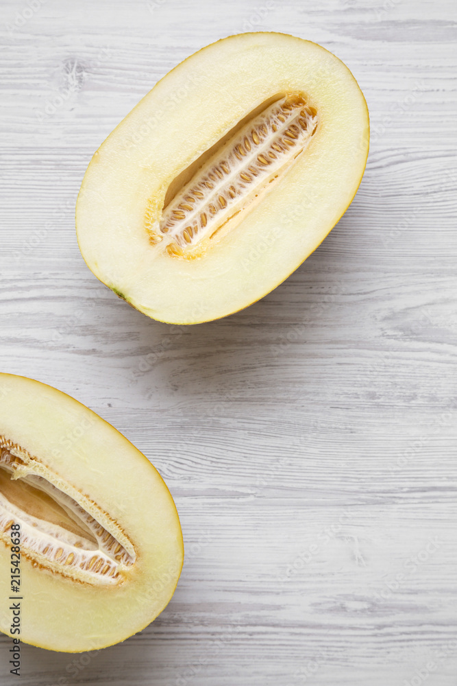 Two halves of melon, view from above. Overhead, flat lay. Two halves of melon, view from above. Overhead, flat lay.