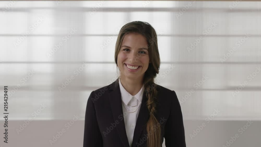 attractive business woman portrait of young caucasian female intern laughing cheerful looking at camera wearing stylish formal suit attractive business woman portrait of young caucasian female intern laughing cheerful looking at camera wearing stylish formal suit