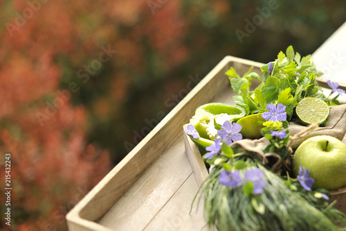 green apples and lime, green onions. Autumn Bouquet of fruits and flowers