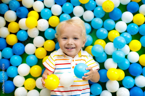 Kids play in ball pit. Child playing in balls pool
