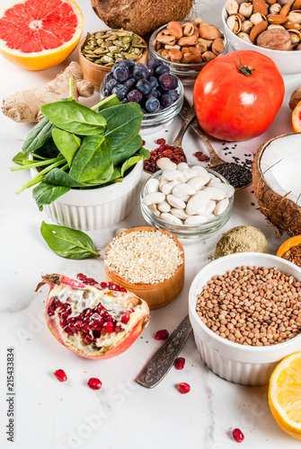 Set of organic healthy diet food, superfoods - beans, legumes, nuts, seeds, greens, fruit and vegetables.. white background copy space.