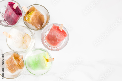 Wallpaper Mural Summer party food ideas, frozen boozy alcohol cocktails popsicles - Prosecco, Vodka lime mojito, Champagne, Bellini, Margarita, Negroni etc white marble table copy space Torontodigital.ca