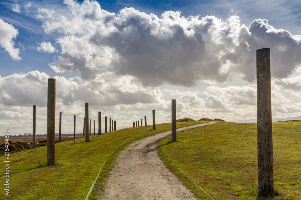 A Hilly Path Through Wooden Posts