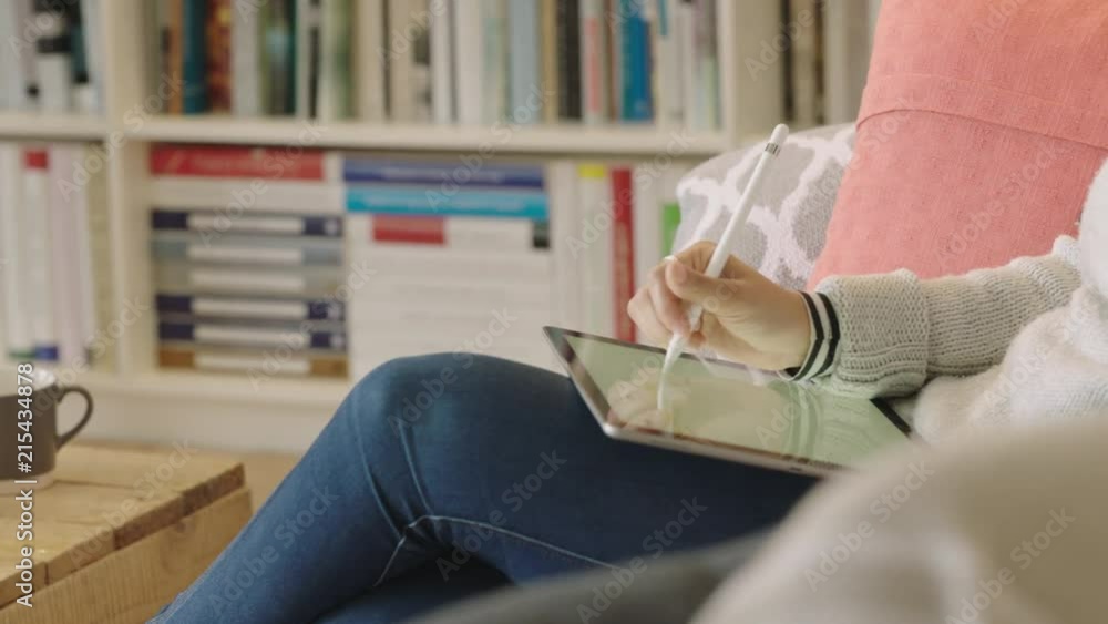 woman hands using tablet pc drawing holding stylus pen female designer sketching on electronic touchpad device screen sitting relaxing at home woman hands using tablet pc drawing holding stylus pen female designer sketching on electronic touchpad device screen sitting relaxing at home