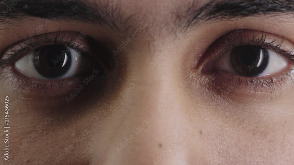 close up man brown eyes opening looking at camera blinking iris beauty close up man brown eyes opening looking at camera blinking iris beauty