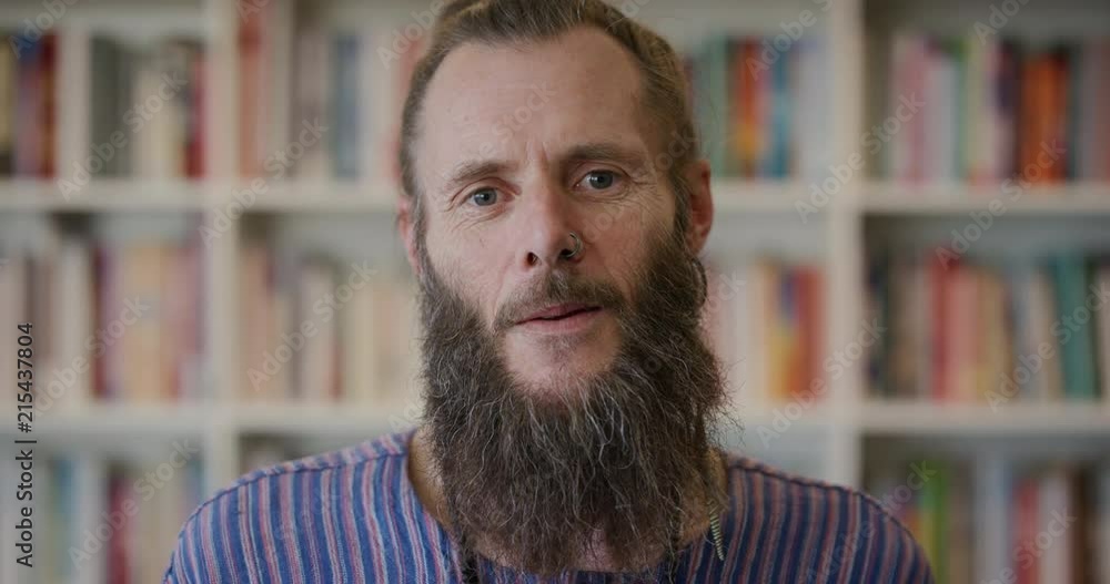 portrait happy mature hippie man looking confident experienced entrepreneur enjoying successful lifestyle bearded caucasian male wearing nose ring portrait happy mature hippie man looking confident experienced entrepreneur enjoying successful lifestyle bearded caucasian male wearing nose ring