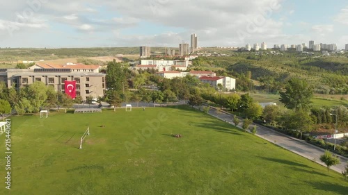 Green college campus on a sunny day (aerial) photo