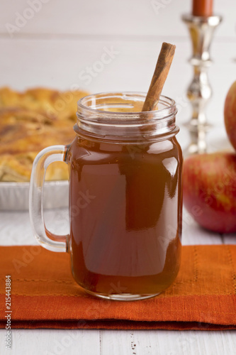 Hot Apple Cider with an Apple Pie and Cinnamon Stick