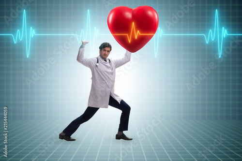 Doctor cardiologist supporting cardiogram heart line