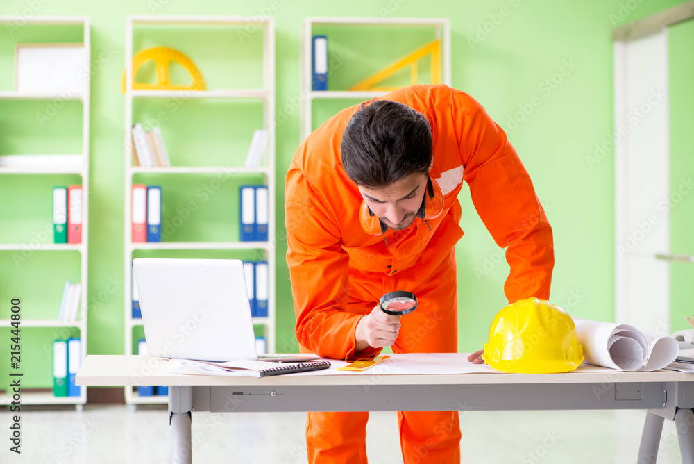 Construction supervisor planning new project in office Construction supervisor planning new project in office