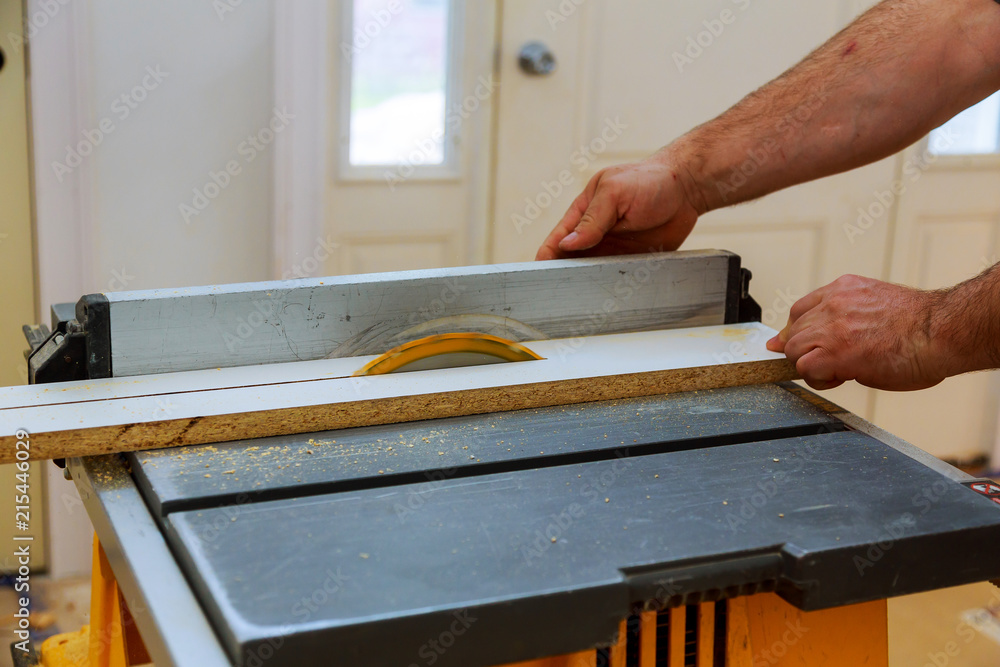 Base trim the miter saw Carpenter cutting wood Base trim the miter saw Carpenter cutting wood