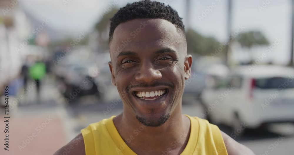portrait of attractive african american man smiling cheerful looking at camera enjoying summer vacation in urban city waterfront handsome black male happy satisfaction portrait of attractive african american man smiling cheerful looking at camera enjoying summer vacation in urban city waterfront handsome black male happy satisfaction