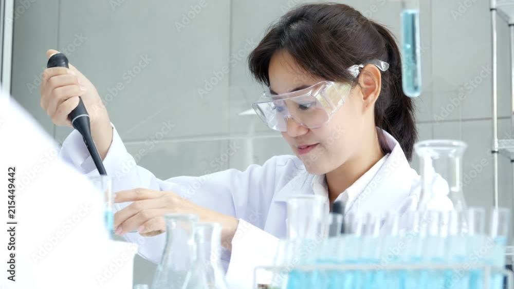Asian Scientist drop solid in test tube. Science work at laboratory. People with medical, science, doctor, healthcare concept. 4K Resolution. Asian Scientist drop solid in test tube. Science work at laboratory. People with medical, science, doctor, healthcare concept. 4K Resolution.