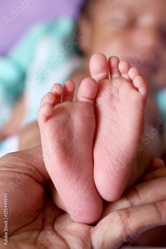 Close up of tiny feet of newborn baby © godsandkings