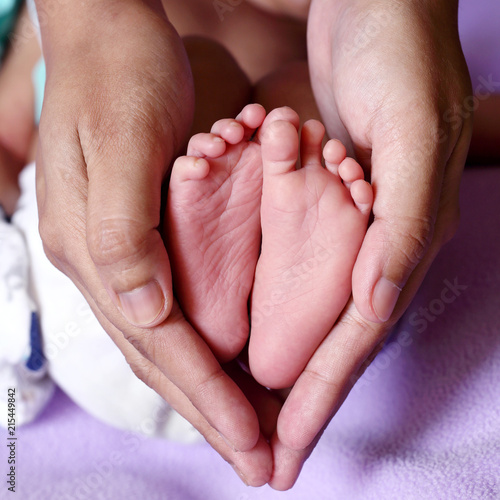 Close up of tiny feet of newborn baby